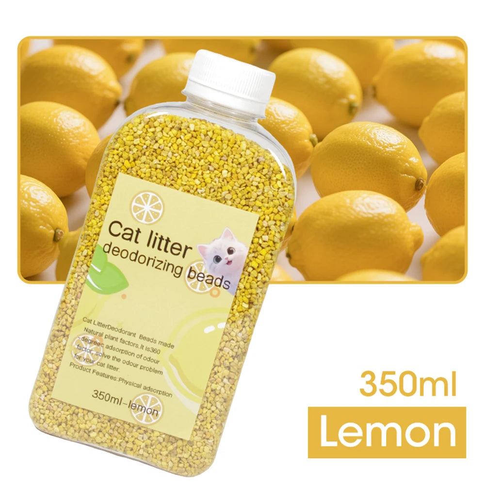 A bottle of Cat Litter Deodorizing beads in lemon scent next to fresh lemons.