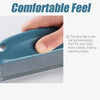 A hand is gripping a blue lint and pet hair remover brush, showing its grip design for easier cleaning.
