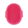 A bright pink soft rubber pet grooming brush with numerous small rubber bristles.