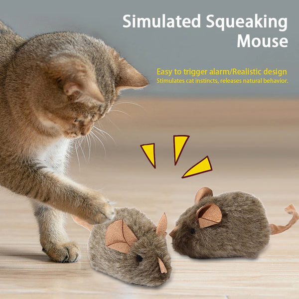 A simulated squeaking mouse toy is shown next to a cat, demonstrating its realistic design and ability to trigger cat instinc