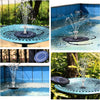 A solar powered water fountain spraying water into a pool or garden, featuring a dark colored disc and a central nozzle.