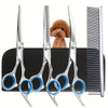 A set of stainless steel dog grooming scissors with a fluffy dog head visible in the background.