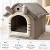 A gray pet house for dogs with a textured roof and entrance, shown with size options.