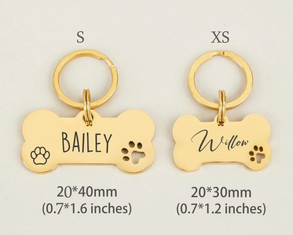 Gold bone-shaped stainless steel dog ID tags for Bailey and Willow, available in small and extra sizes.
