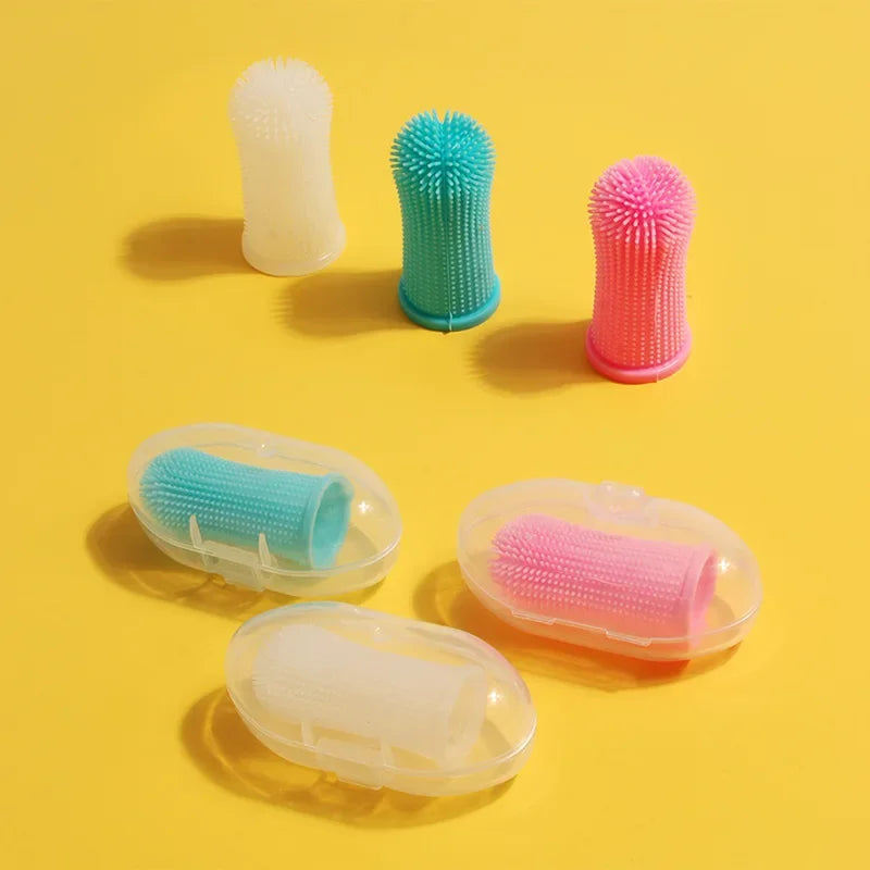 A set of silicone pet toothbrushes for dogs and cats in various colors including white, green, pink, and clear.