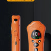 An orange ultrasonic dog repellent device is shown standing on a dark surface.