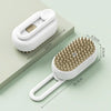 A white pet grooming brush with a steam spray attachment is shown on a light green surface.
