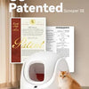A white replacement cat litter mat for an automatic litter box sits on a wooden floor.