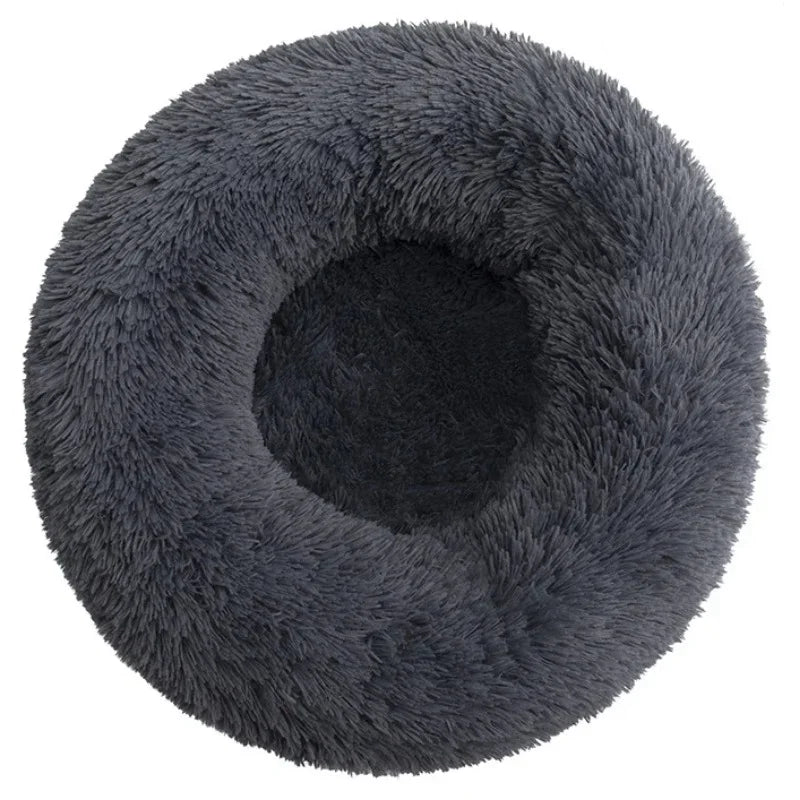 A round, dark gray ultra-soft plush pet bed for dogs and cats.