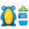 Entrenador para entrenamiento de inodoro en forma de rana azul con interior amarillo y componentes de silicona.