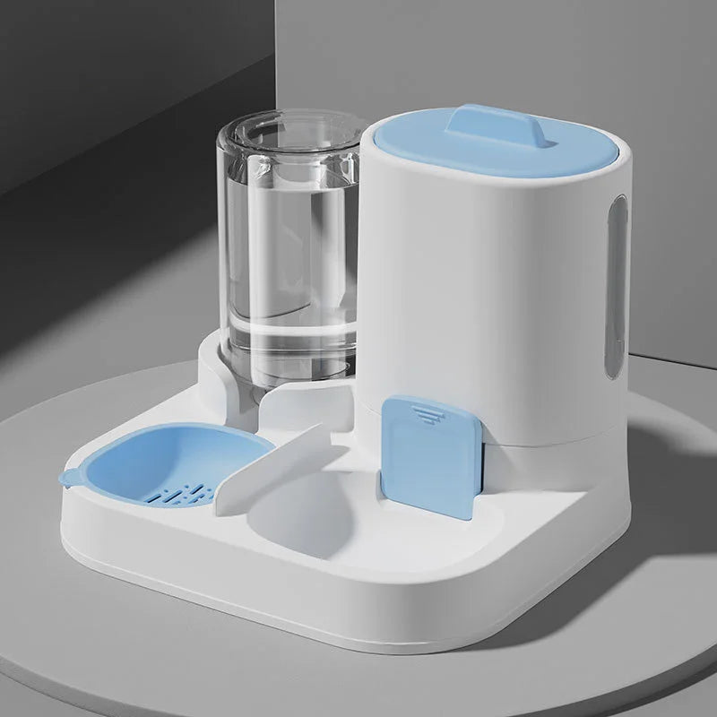 A white 2-in-1 automatic pet feeder and water dispenser with a clear glass bowl and a light blue lid.