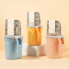 Three plastic containers of stainless steel cat litter shovels in blue, yellow, and pink.