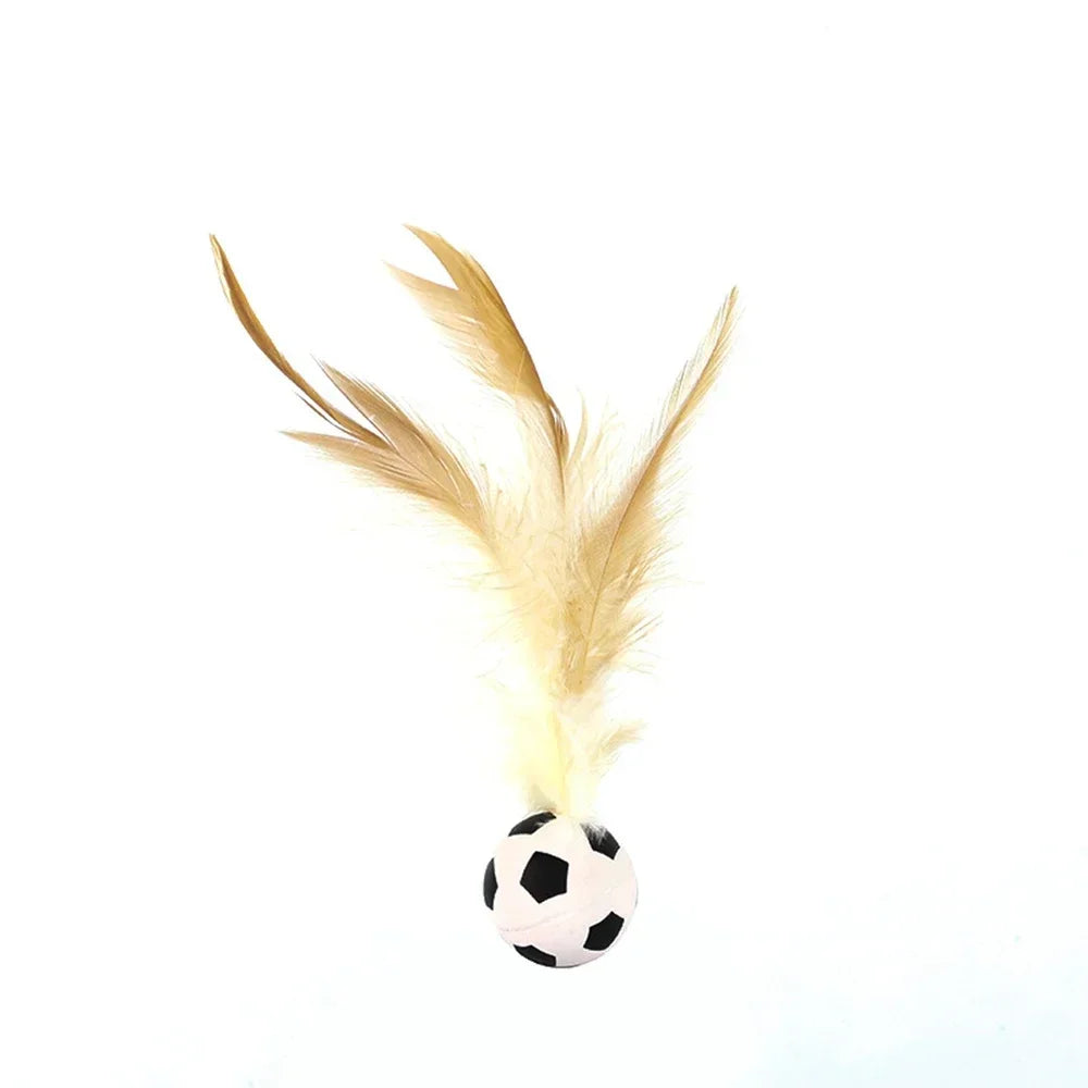 A light tan feather is attached to an interactive cat ball for hunting fun.
