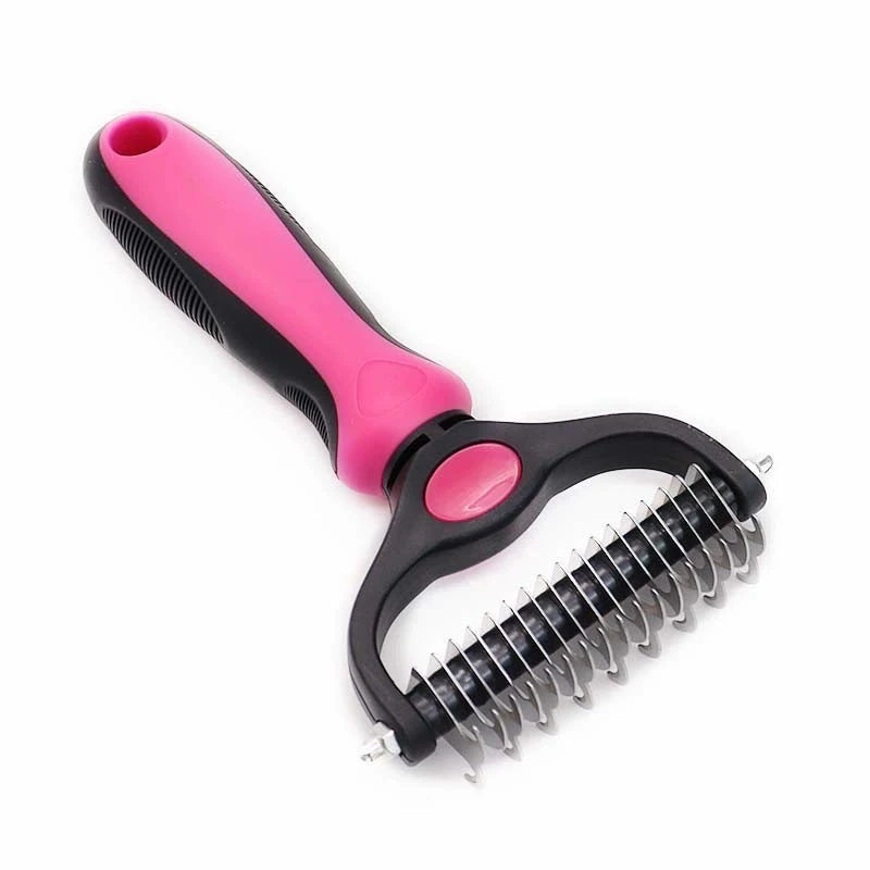A pink and black dual-sided pet deshedding rake brush for dogs and cats.