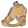 A tan tactical dog harness with a reflective vest is shown from above.