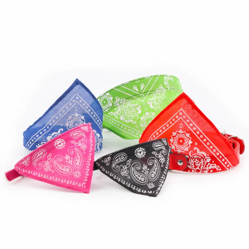 Three colorful fabric bandana collars in blue, green, and red displayed on a white background.