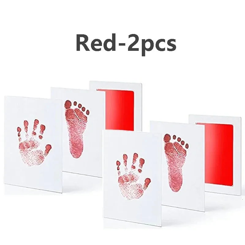 Two red baby handprint and footprint kits displayed on a white background.
