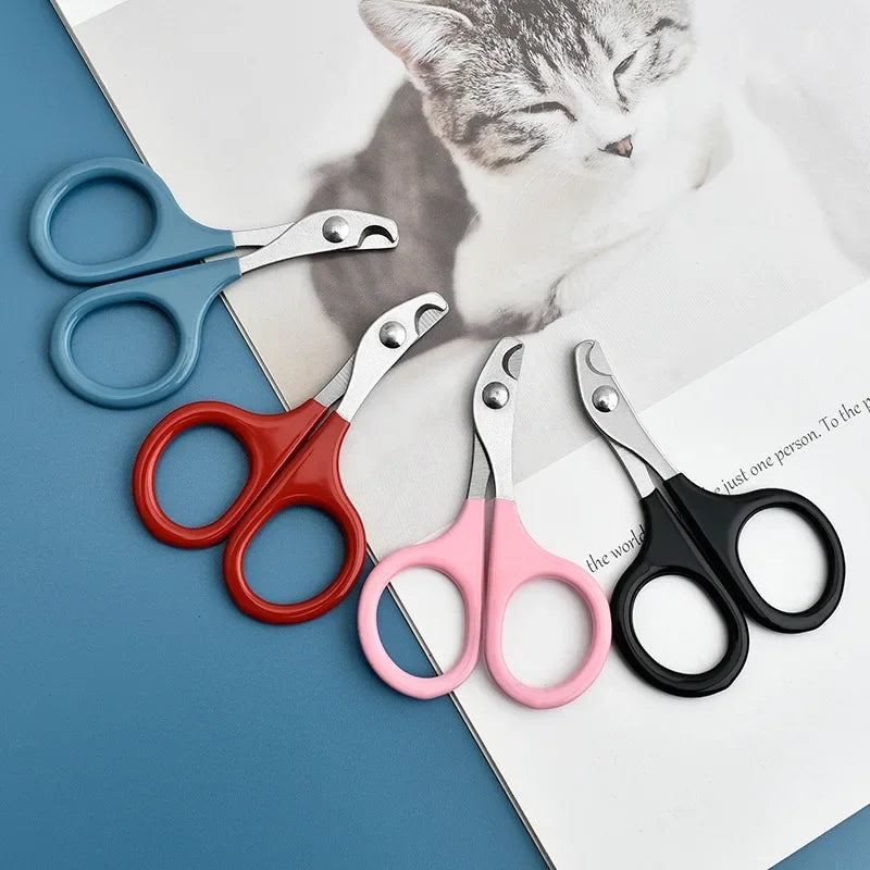 A collection of professional pet nail clippers and trimmers in various colors resting on a white background.
