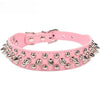 Pink leather dog collar with silver spikes and buckle closure