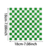 A green and white checkerboard pattern of oil-proof sandwich wrapping paper.