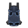 A dark blue fabric backpack carrier designed for transporting cats and dogs.
