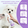 A person is using a white spray bottle of Pet Paw Cleaner to gently scrub a white dog's paw.