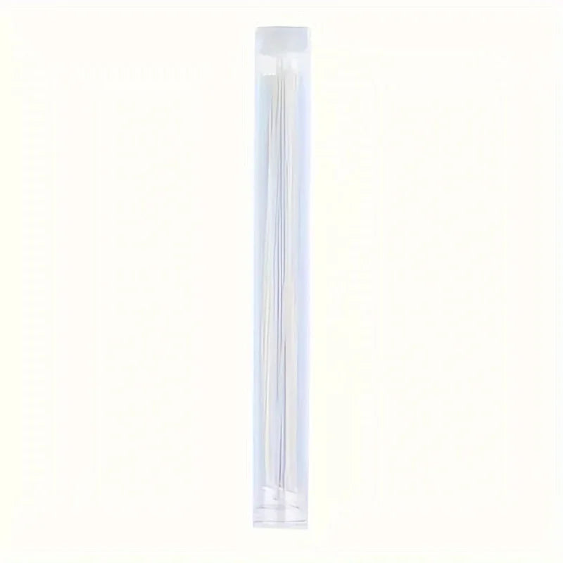 A clear plastic tube containing multiple thin, pointed cleaning tools for the ear.