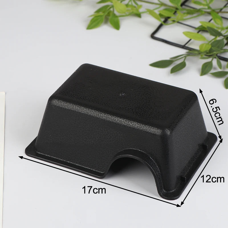 Black reptile and small animal hide box with a rectangular shape and a curved opening