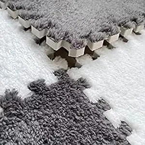 A close-up view of a gray cozy fleece pet warming mat with a textured surface.