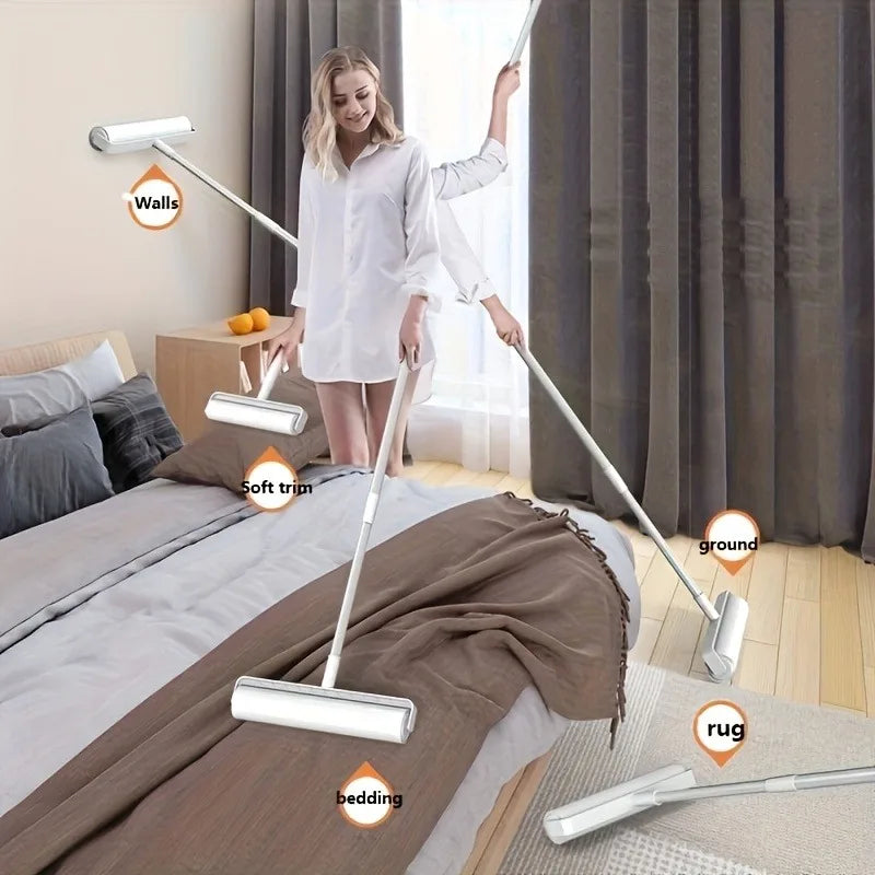 A woman is using an extendable pet hair lint roller on a wall, demonstrating its use for cleaning.