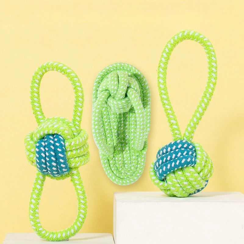 A bright lime green rope ball dog toy with a loop, featuring blue accents, displayed on a white surface.