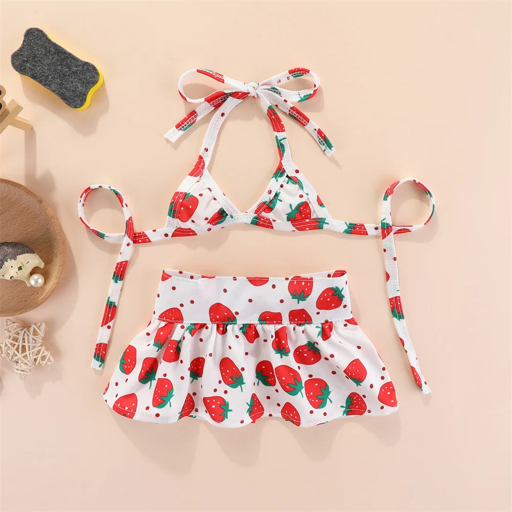 A red and white strawberry print summer pet swimsuit for dogs and cats displayed on a light background.
