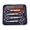 A black case holding a 5-in-1 stainless steel grooming scissors set with various blades and combs.