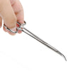 A hand holds a stainless steel pet ear hair tweezers with a curved tip.