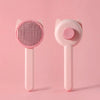 A pink one-button pet hair removal brush for cats and dogs shown against a light pink background.