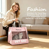 A woman holds a pink mesh pet travel bag designed for cats and small dogs in a bright living room setting.