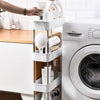 A white 3/4 tier mobile storage rack holding various beauty and personal care products near a washing machine.