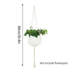 White macrame plant hanger with a hanging pot and a long cord for indoor or outdoor decor