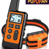An orange and black electric dog training collar with a digital display and control buttons.