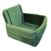 A green quilted dog car seat with a removable orthopedic cushion.