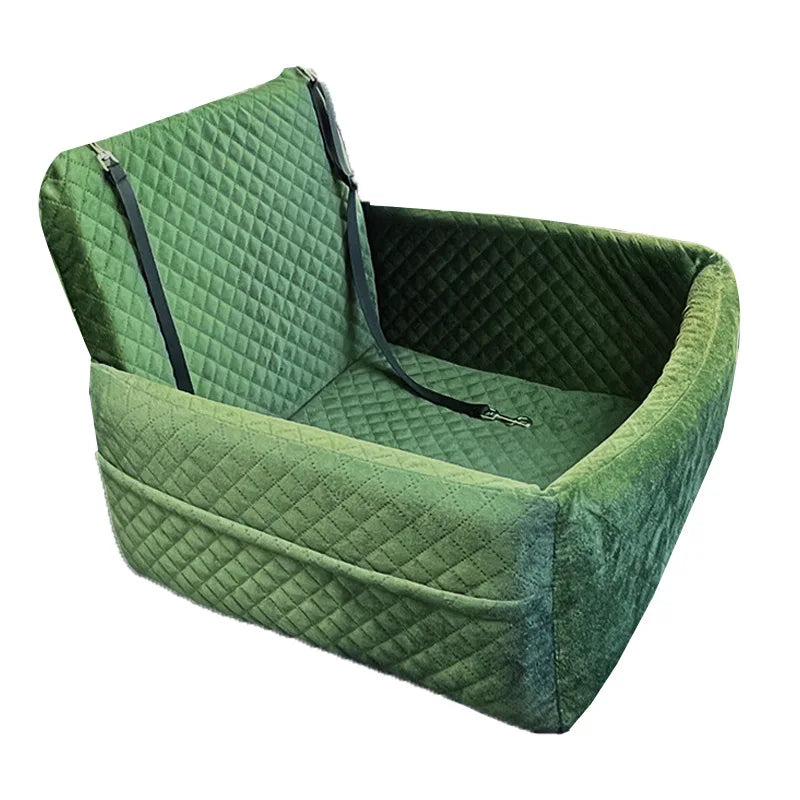 A green quilted dog car seat with a removable orthopedic cushion.