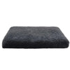 A rectangular, dark gray ultra plush orthopedic dog bed with a fluffy texture.