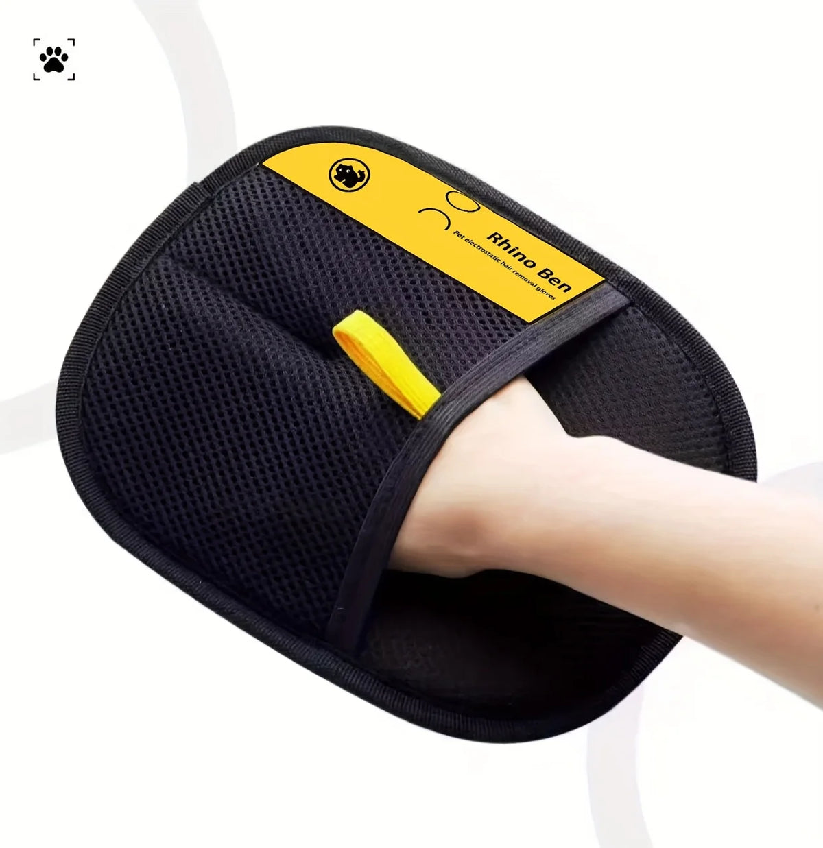 A black double-sided pet hair removal glove with a yellow grip and branding is shown being used on a person's hand.