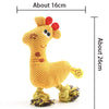 A yellow plush squeaky donkey dog toy with purple accents, shown next to a measurement scale.