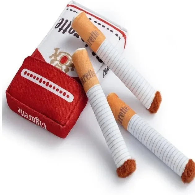A red box containing a cylindrical dog chew toy with white stripes and brown tips.