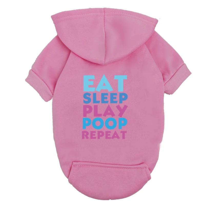 A pink hoodie featuring text that reads Eat Sleep Play Poop Repeat