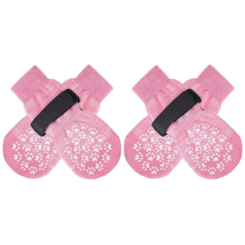 Pink anti-slip dog socks with traction straps for pets