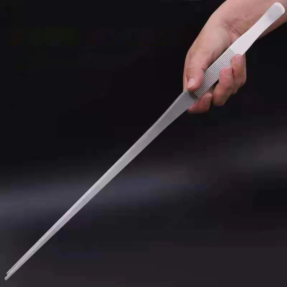 A hand holds a stainless steel aquarium plant tweezers set with fine, parallel tips.