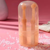 A clear silicone pet toothbrush set for cats and dogs is displayed in a pink storage case on a pink surface.