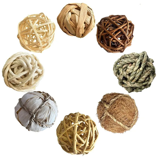 A collection of natural handwoven vine chew toys for small rodents in various shades of tan and brown.